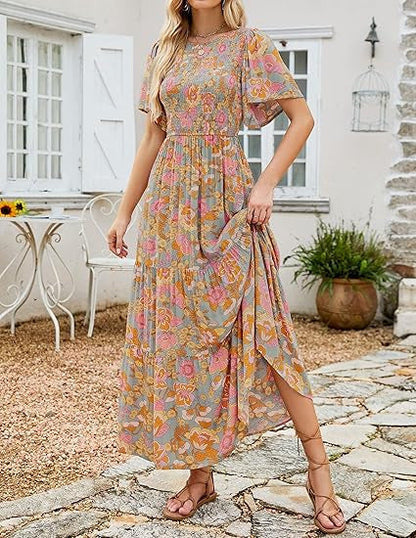 🌷🌸Rochie maxi vaporoasă cu talie înaltă, imprimeu floral, mâneci scurte evazate, guler rotund, elastică, pentru vară 2026
