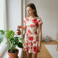 Rochie elegantă cu imprimeu floral și volan la tiv